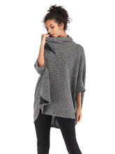 Suéter informal holgado de media manga con cuello alto y color liso